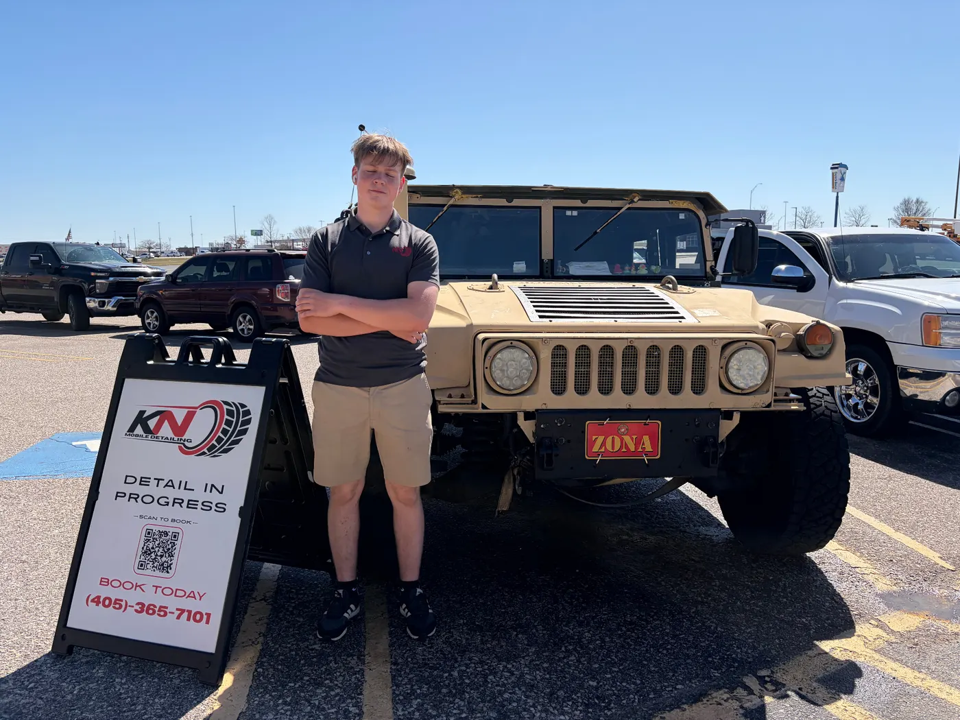 KN Mobile Detailing technician with military Humvee
